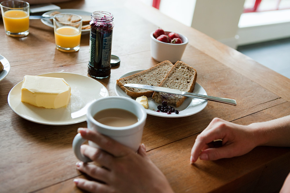 Woman having breakfast, high angle